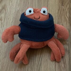 Jelly Cat cozy crew crab, complete with sweater!